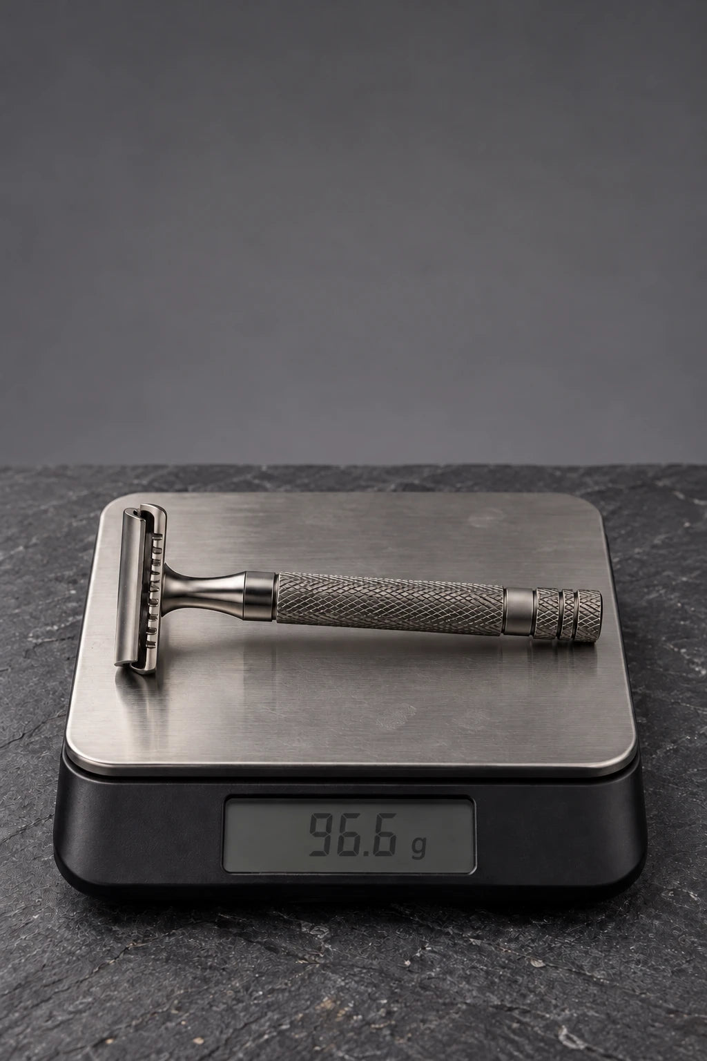 CLOSE CALL 001 razor on a digital scale reading 96.6 grams